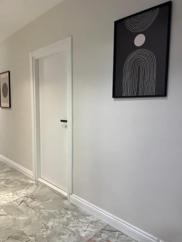 a room with a door and a picture on the wall at Casa Florya Travel Apartments in Istanbul
