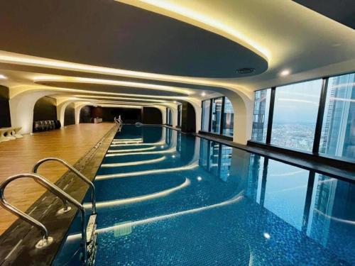 a swimming pool in the middle of a building at The Nest High-Floor Studio with City View in Ðông Khê