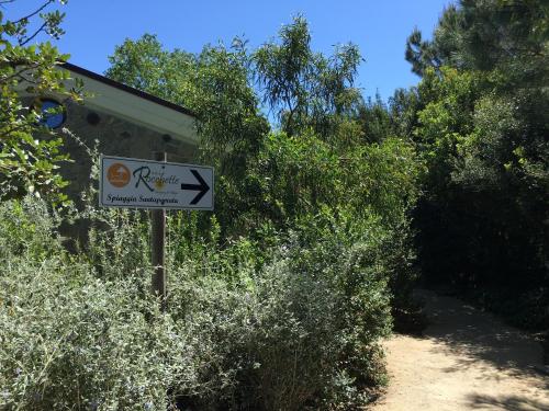 a sign in front of a building with a sign sidx sidx sidx at Camping Village Rocchette in Castiglione della Pescaia