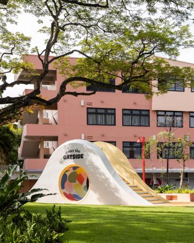a slide in front of a building at Alma House in Singapore