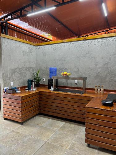 a restaurant with a counter with bananas on it at Hotel São Francisco in São Francisco do Sul