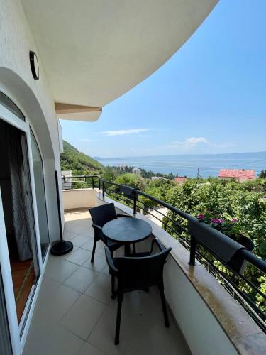 a balcony with a table and chairs and a view at Villa Stefanoski in Konsko