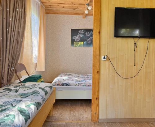 Postel nebo postele na pokoji v ubytování Zem Priedēm