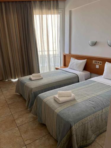 Postel nebo postele na pokoji v ubytování Flamingo Beach Hotel
