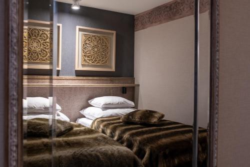 Katil atau katil-katil dalam bilik di Aries Lago Park Hotel & SPA, Mazury