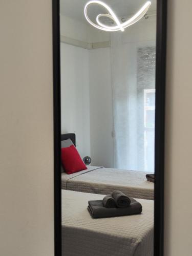 Ένα ή περισσότερα κρεβάτια σε δωμάτιο στο Sempione Apartment