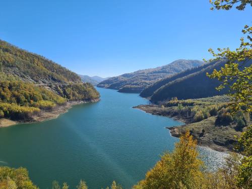 a view of a river in a valley at Vama Buzaului Hillside Barn - camere la munte in Buzoel