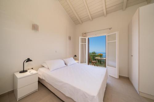 A bed or beds in a room at The Sunset Villa Kefalonia