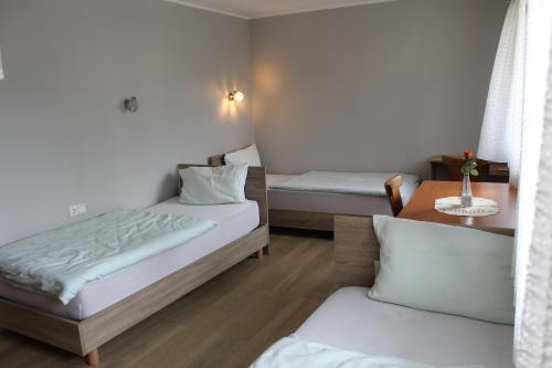 Postel nebo postele na pokoji v ubytování Hotel Garni Postkutsche