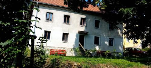 a large white building with a red roof at Chalupa Vagner, Pernek in Horní Planá