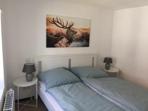 Cama o camas de una habitación en Die Kleine Feine Ferienwohnung
