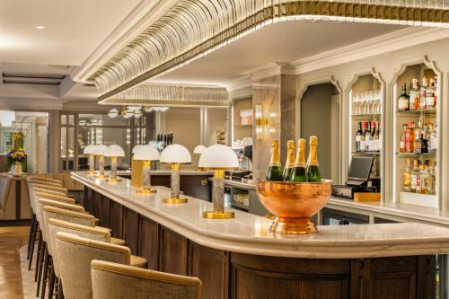 a bar with chairs and bottles of wine at Brooks Hotel in Dublin