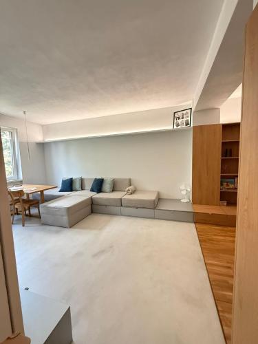 a living room with a couch and a table at Central & Modern Apartment in Banská Bystrica