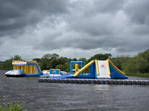 a group of slides in the water at Lovely Caravan number 96 at Three Lochs Holiday Park in Kirkcowan