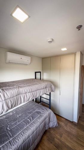 a room with two beds and a closet at Family apartment in Carmelitas in Asuncion