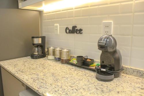 a counter top with a coffee maker on it at Family apartment in Carmelitas in Asuncion