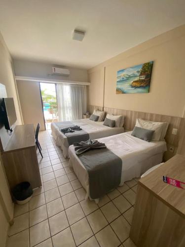 Кровать или кровати в номере Hotel Costa do Atlantico
