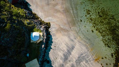 an overhead view of a beach with a boat on it at Skårungen - Hotel, Cabins and Camping in Kabelvåg
