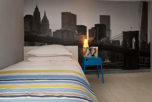 a bedroom with a bed with a view of the city at Sea Margarita Apartment in Pag