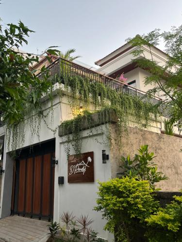 a white building with a fence and a balcony at 3BR Brand New Cozy Private Villa D'Pondok Balangan in Uluwatu