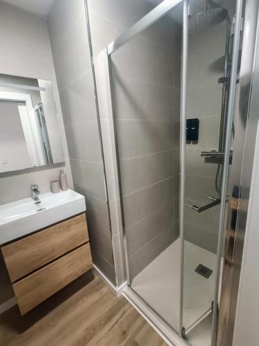 a bathroom with a shower and a sink at Wind Rose Gandia Beach in Playa de Gandia
