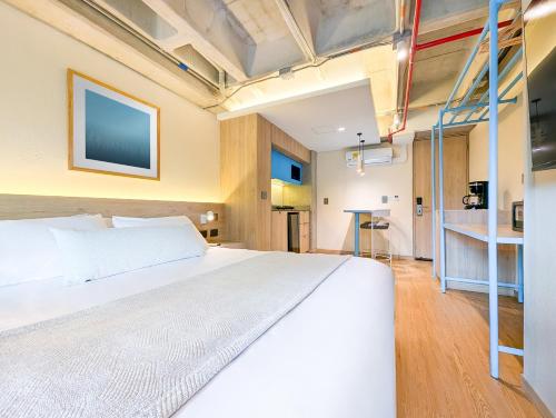a bedroom with a bed and a ladder at Hotel Once22 in Sabaneta