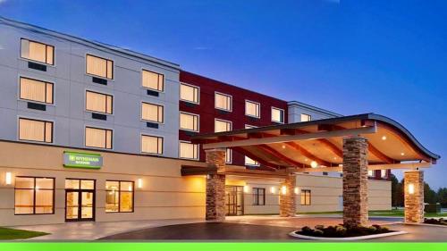 a rendering of a hotel with a building at Wyndham Garden State College in State College