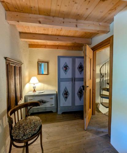 a room with a desk and a chair and a table at Borgo Selvapiana in Morbegno