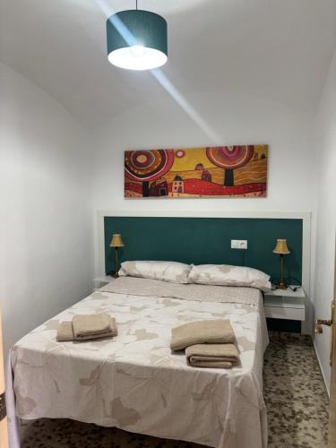 Ένα ή περισσότερα κρεβάτια σε δωμάτιο στο Casita de Don Juan Tenorio