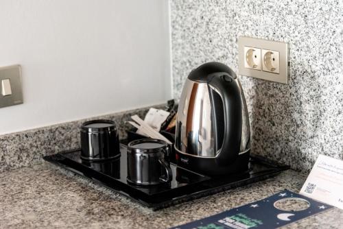 NM Suites by Escampa Hotelsにあるコーヒーまたはお茶