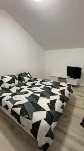 Ένα ή περισσότερα κρεβάτια σε δωμάτιο στο Maison calme et sécurisée wifi