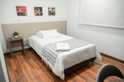 Ένα ή περισσότερα κρεβάτια σε δωμάτιο στο Hotel Quinta del Café