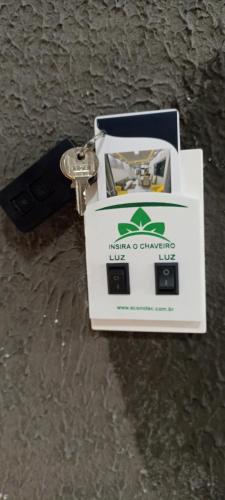 a key chain sitting on top of a table at Aconchegante in Matinhos