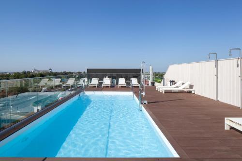 a swimming pool on the roof of a building at Leflet Sanlucar in Sanlúcar la Mayor