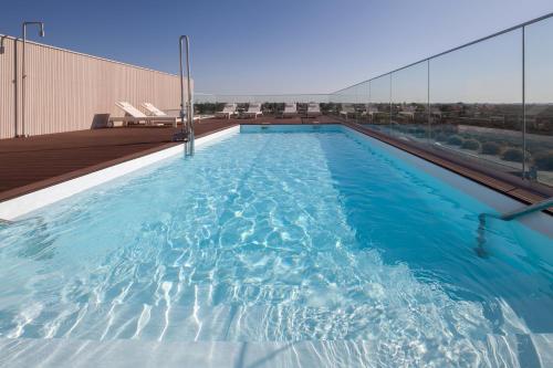 a swimming pool on top of a building at Leflet Sanlucar in Sanlúcar la Mayor