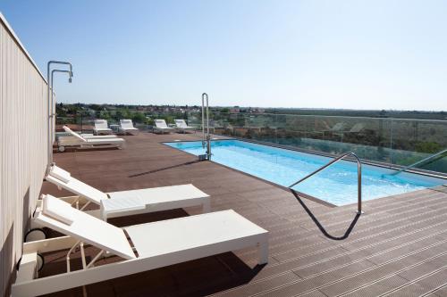 a swimming pool on the roof of a building at Leflet Sanlucar in Sanlúcar la Mayor