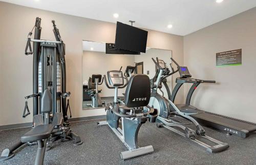 a gym with several tread machines in a room at Extended Stay America Premier Suites - Bradenton in Bradenton