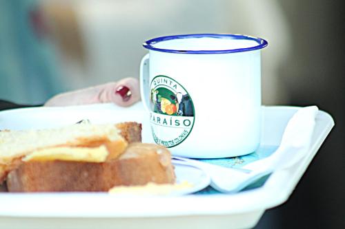 a plate of bread and a cup of coffee at Cabana da Quinta Paraíso in Uruguaiana
