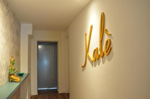 a hallway with baseball cleats on the wall at Kalé in Pordenone