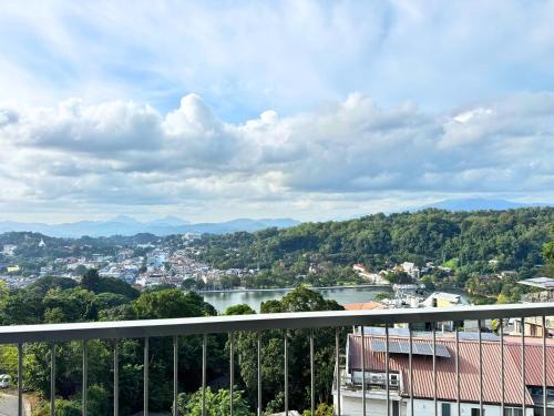 a view of a city and a river from a balcony at 360 Viewpoint by Queens Mount in Kandy