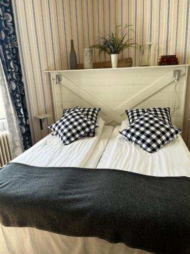 Postel nebo postele na pokoji v ubytování Hotell Aina