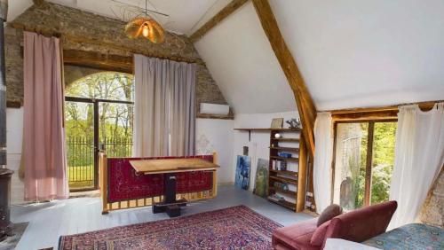 a living room with a ping pong table at French Manor House with private gardens and pool in Foissac