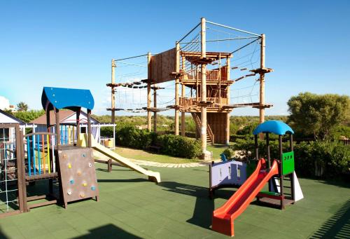 a playground with several slides and a play structure at Grupotel Club Turquesa Mar in Son Xoriguer