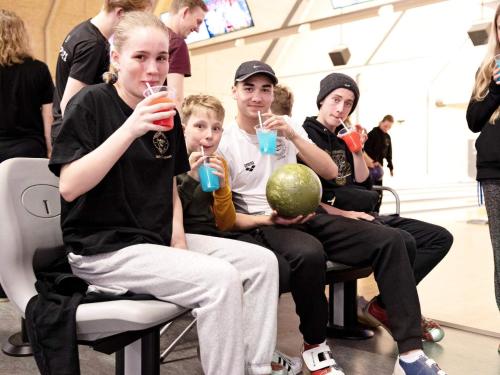 a group of people sitting in chairs drinking juice at 4 star holiday home in Nørre Nebel in Nørre Nebel