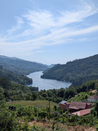 a view of a river in the middle of a valley at Caniçada Home in Vieira do Minho