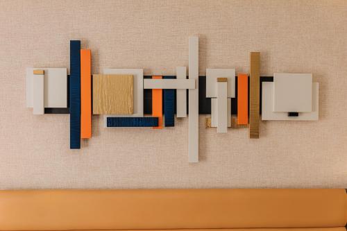 a painting of the word art on a wall at Comfort Hotel Astana in Astana