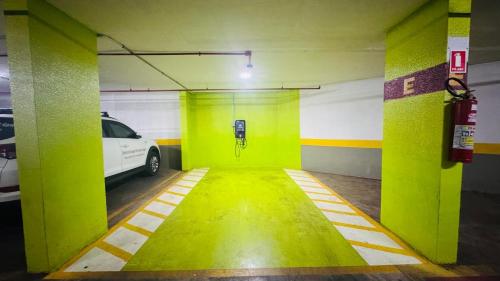 a parking garage with a car parked in it at Quarto Mobiliado no Hotel Go Inn Taguatinga com Wi-Fi, Ar Condicionado e Estacionamento Grátis in Brasilia