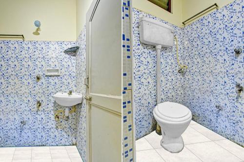 a bathroom with a toilet and a sink at Hotel O Dream Palace Guest House Near Marina Beach in Chennai