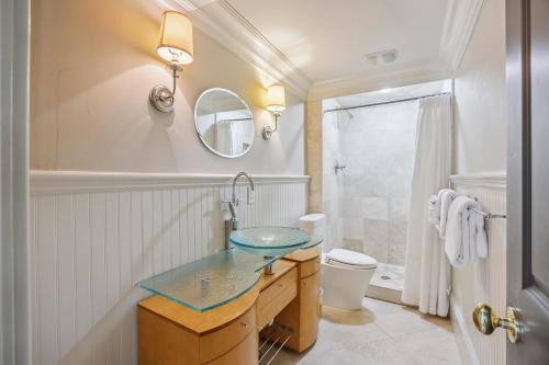 a bathroom with a sink and a mirror at AV9-02: 9 2nd Avenue in Isle of Palms