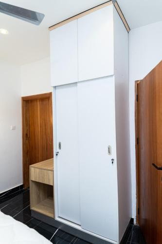 Кровать или кровати в номере Peaceful Escape at H Village, Tema 25